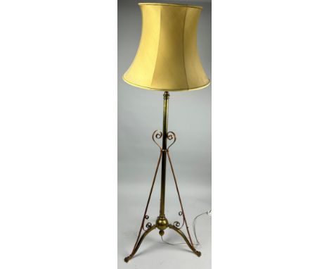 A TELESCOPIC ART NOUVEAU BRASS TRIPOD STANDARD LAMP WITH SCROLLS AND ROUNDELS,135cm H 