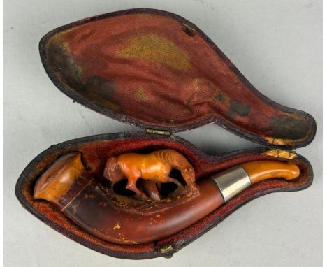 AN AMBER MEERSCHAUM PIPE WITH A HORSE, in a case.11cm L 