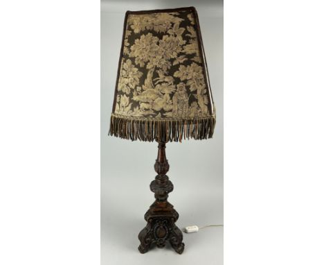 AN 18TH CENTURY TURNED OAK CANDLESTICK ADAPTED INTO A LAMP WITH EARLIER TAPESTRY SHADE65cm H 