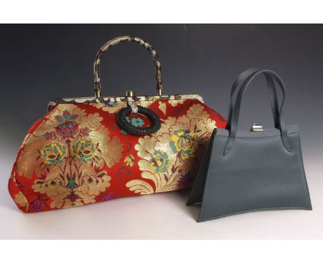 A Shanghai Tang vintage handbag,in a red oriental woven silk brocade fabric with metallic flowers, stiff fabric handle and ja
