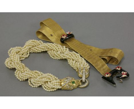 A simulated pearl torsade necklace, by Jomaz,with a paste set lion head clasp and plaited simulated pearls,together with a Pi