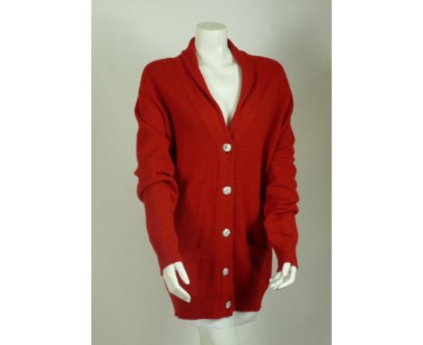 A Chanel red cashmere cardigan,rib knitted cuffs and hemline, fastening with five assorted Chanel enamel and silver tone butt