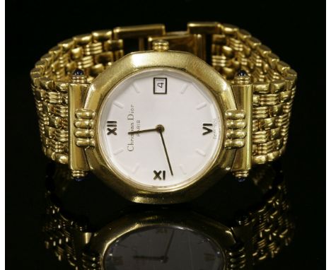 A gentlemen's gold-plated Christian Dior quartz bracelet watch,with a circular cream dial to an hexagonal case, raised gilt R