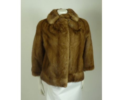 A caramel mink jacket,with 'Leon, 29 Gloucester Road, London SW7' label, anda 1920s Scotch mole black fur coat, with 'Weald F