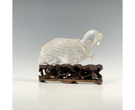 A Chinese carved rock crystal bird figurine with wood base. Near-flawless, this figure rests on a well carved base. This item