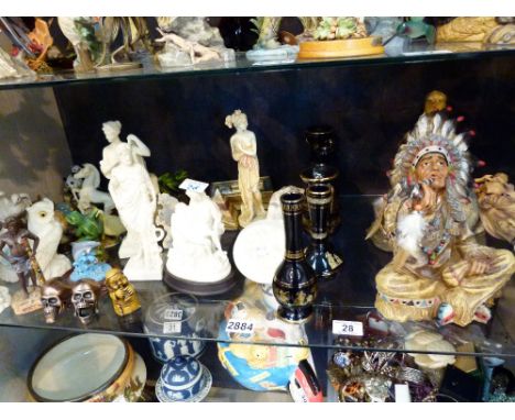 Shelf of mixed figures and vases