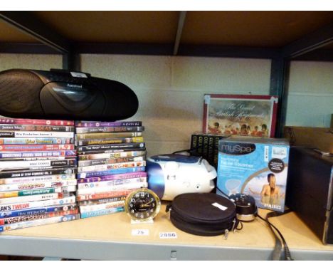 Shelf of mixed items including DVDs