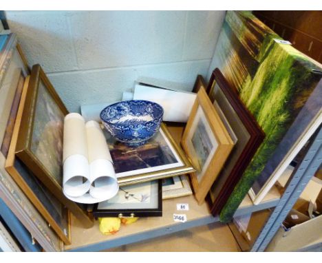 Shelf of mixed items including prints and blue and white bowl