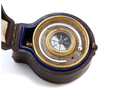 A late 19th Century brass travelling pocket barometer/thermometer and compass combined, in the original morocco fitted case w