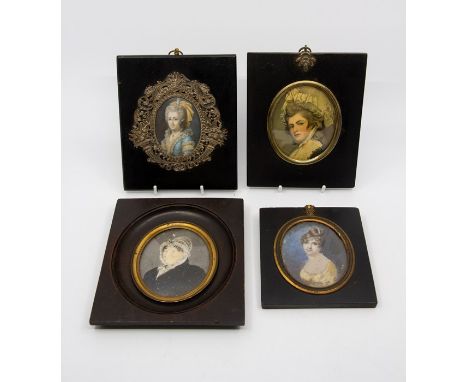 A Victorian oval portrait miniature of an elderly lady wearing a lace bonnet, on ivory, 9cm buy 7cm, another of a young lady,