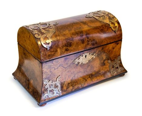 A Victorian burr walnut tea caddy, circa 1860, domed cover, outswept base, pierced brass Gothic mounts, triple division inter