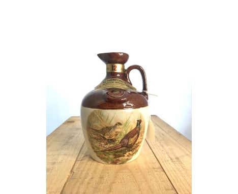 Rutherford's 12 year old Scotch whisky, jug decanter 1970's, in original box.Distillery: Age: 12 yearsBottled: c. 1970's Bott