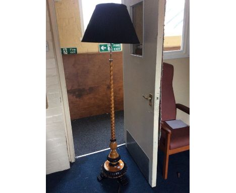 A 19th C Bidermeier blonde wood and ebonised adjustable standard lamp.&nbsp; Tapered spiral turned column with floral carved 