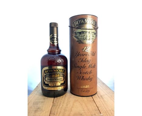 A bottle of Bowmore 12 year old Single Malt Scotch Whisky. Dumpy bottle, in excellent condition. Region: IslayDistillery: Mor