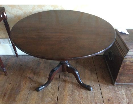 A 19th Century mahogany circular top tripod table above a turned collumn on three cabriole feet.