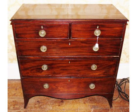 A George III mahogany chest of drawers, circa 1800, comprising two short over three long graduated drawers, raised on bracket