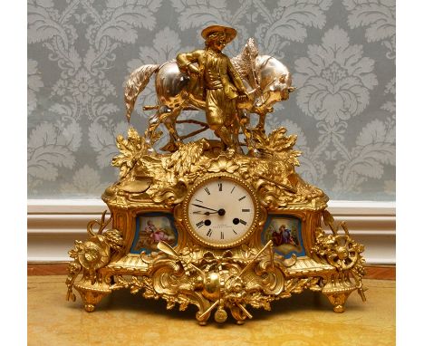 A late 19th Century French gilt metal eight day bracket clock, of Rococo Revival design, circa 1870, surmounted&nbsp; with a 