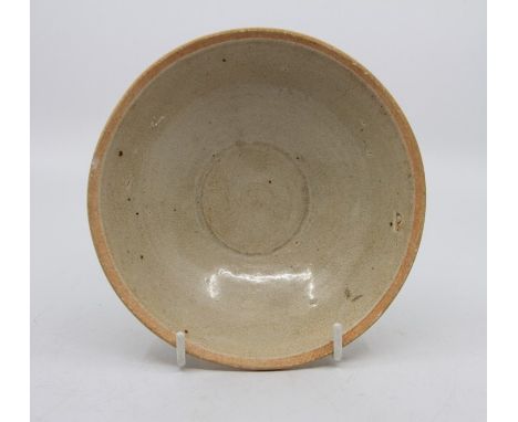 A Chinese Song Dynasty circular bowl, with unglazed rim and straw coloured glaze, 15cm diameter, a Whiteware ovoid vase, neck