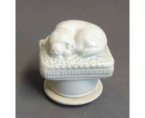 A Staffordshire pottery snuff box with a model of a dog on a cushion, with a screw cover, circa 1800, 4.5cm wide, 4.5cm highC