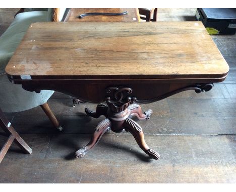 An early Victorian rosewood fold-over card table, raised on a pedestal support, 73cm high, 91cm wide, 45cm deep
