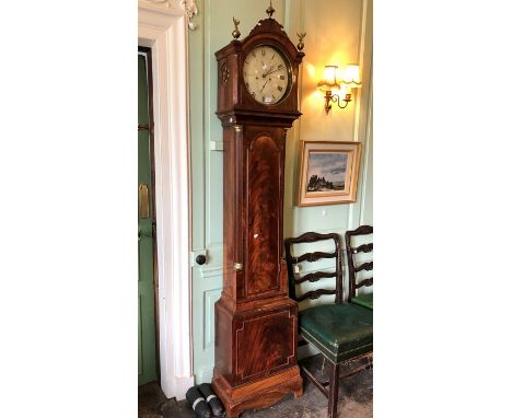 A George III mahogany cased eight day longcase clock, the circular dial inscribed 'Elkington, Brentwood', complete with pendu