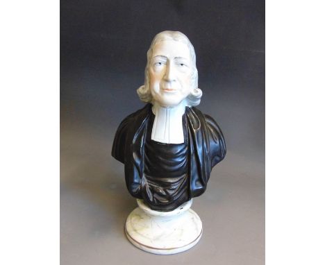 A large Staffordshire Enoch Wood portrait bust of Reverend John Wesley, mounded on a marbled effect circular base with a sing