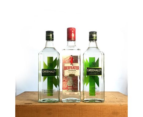 Three bottles of Dry Gin, including two bottles of Greenall's and one bottle of Beefeater.&nbsp;