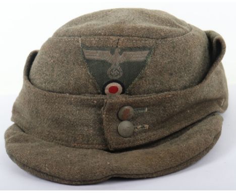 WW2 German Army M-43 Field Cap, well worn example of the M-43 cap in very late war coarse material. Two button front configur