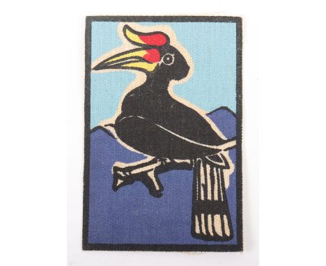 Scarce Post War Sarawak Border Scouts Printed Formation Sign, being the rhinoceros hornbill native bird on light and dark blu