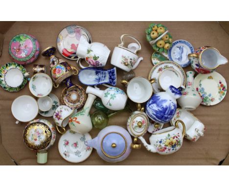 A collection of miniature ceramics to include Hammersley teapot, an M Holdsworth robin teapot, Crown Staffordshire and others