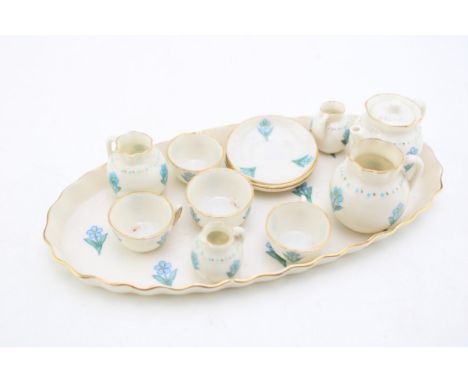 W H Goss miniature tea service, blue floral pattern, to include a teapot, jugs, cups, saucers and others (Qty).  In good cond