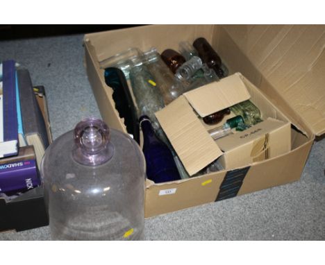 A PINK GLASS DOME AND A QUANTITY OF VINTAGE BOTTLES