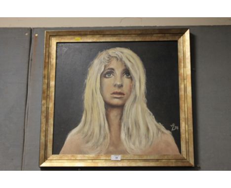 A GILT FRAMED OIL PORTRAIT OF A BLONDE WOMAN