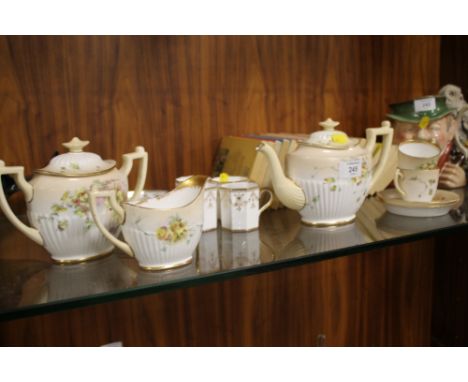 A ROYAL DOULTON TEA FOR TWO TOGETHER WITH WEDGWOOD COFFEE CUPS AND SAUCERS