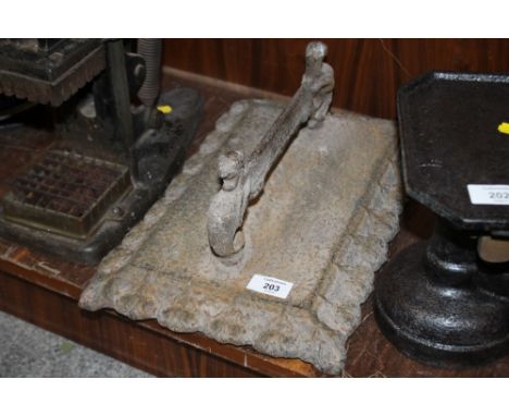 A VINTAGE CAST BOOT SCRAPER