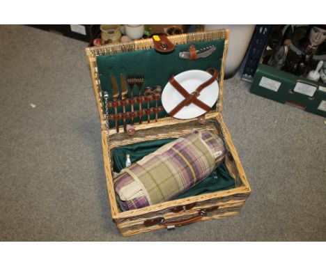A WICKER PICNIC HAMPER 