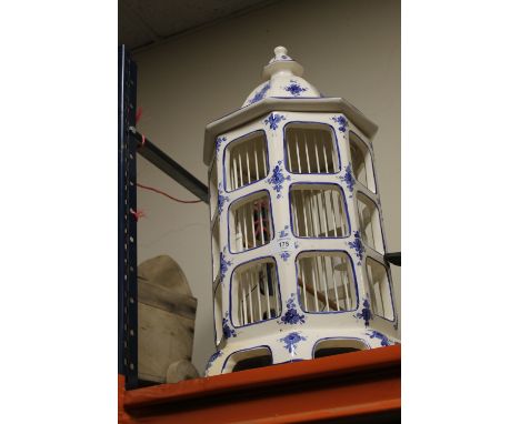 A SMALL ORIENTAL STYLE CERAMIC BLUE & WHITE BIRD CAGE SD 