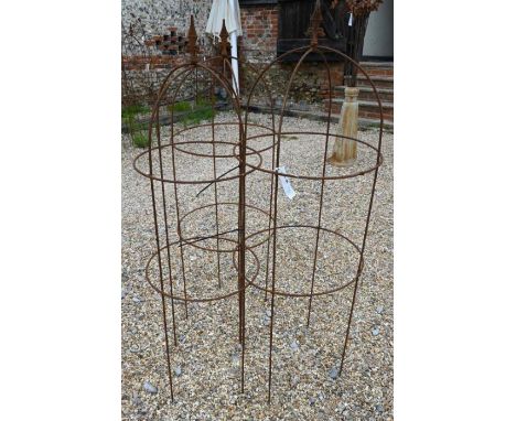 Trio of weathered steel arrow head obelisks (3)