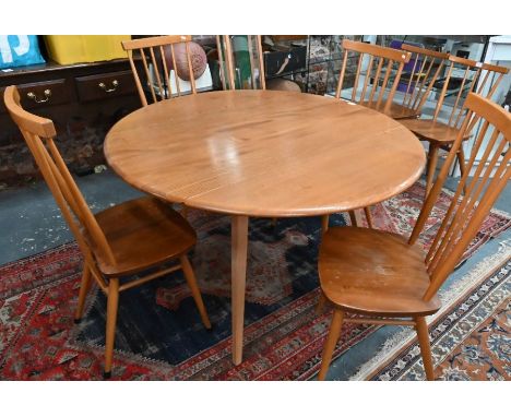 A vintage Ercol drop leaf table to/with four stick back side chairs (5)