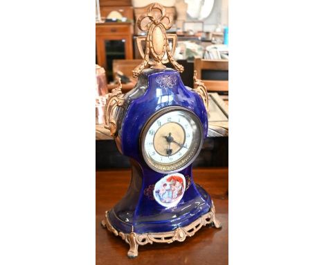A French ceramic blue glazed and gilt metal mounted mantel clock, 40 cm high