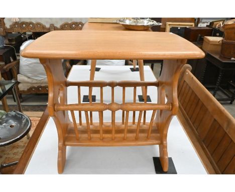 A modern Ercol light elm magazine rack table with spindled under-tier, 55 cm w x 35 cm d x 50 cm h