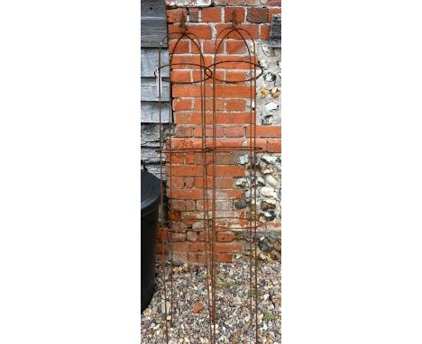 A pair of weathered steel arrow head obelisks (2)