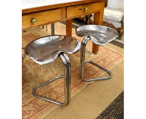 A set of four chrome finish metal 'tractor seat' stools on tubular cantilever frames (4)