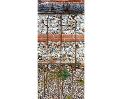 A pair of weathered steel arrow head obelisks (2)