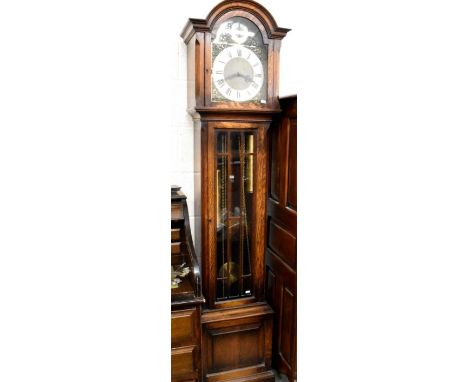 A modern oak longcase clock with brass dial and triple chime movement, part glazed case c/w two weights and pendulum, 188 cm 