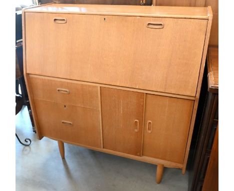 A vintage 'Genuine Burolite Bureau Desk' with fall front panel enclosing fitted interior over drawers and sliding cupboard do