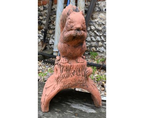 A cast terracotta squirrel ridge tile