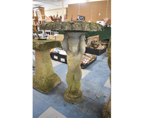 A Reconstituted Stone Figural Garden Sundial in the Form of a Cherub Supporting Lilypad, 48cm diameter and 70cm high 