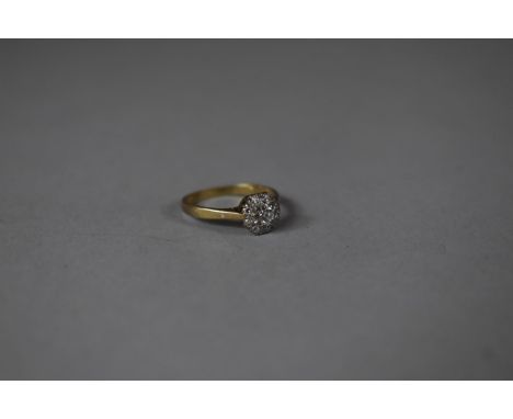 A Small Diamond Cluster Ring on Yellow Gold and Platinum Band 