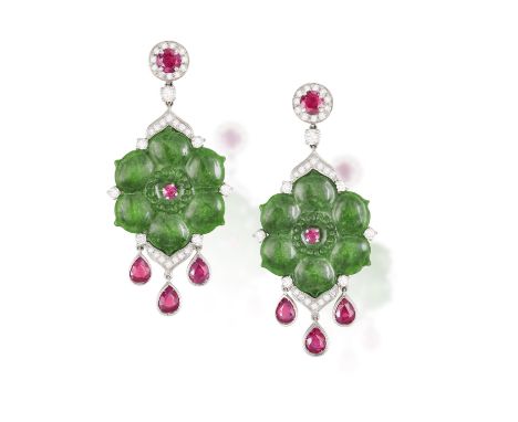 A PAIR OF JADE, RUBY AND DIAMOND EARRINGS, each of pendent design, the central jade plaque carved as a flower and enhanced by